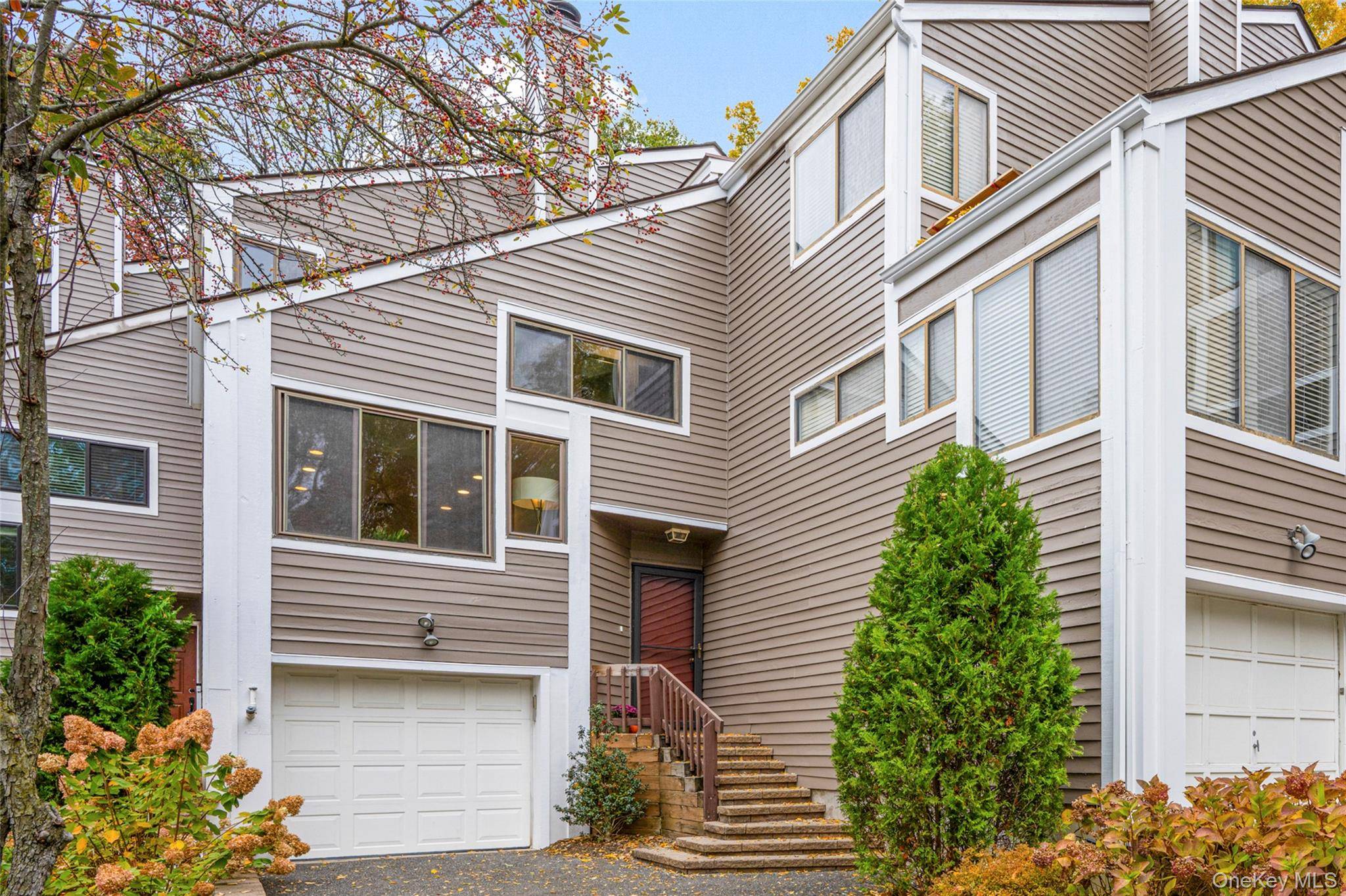 Spacious and bright townhouse in Rye Neck's sought after Top of the Ridge community !