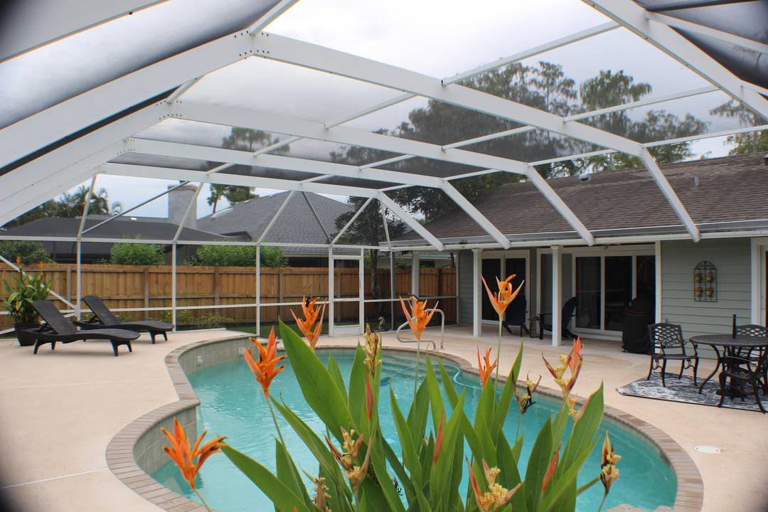 Charming Off Season rental 5, 400 in the heart of Wellington with 3 bed, 2 bath, 2 car garage, heated pool home, no HOA.