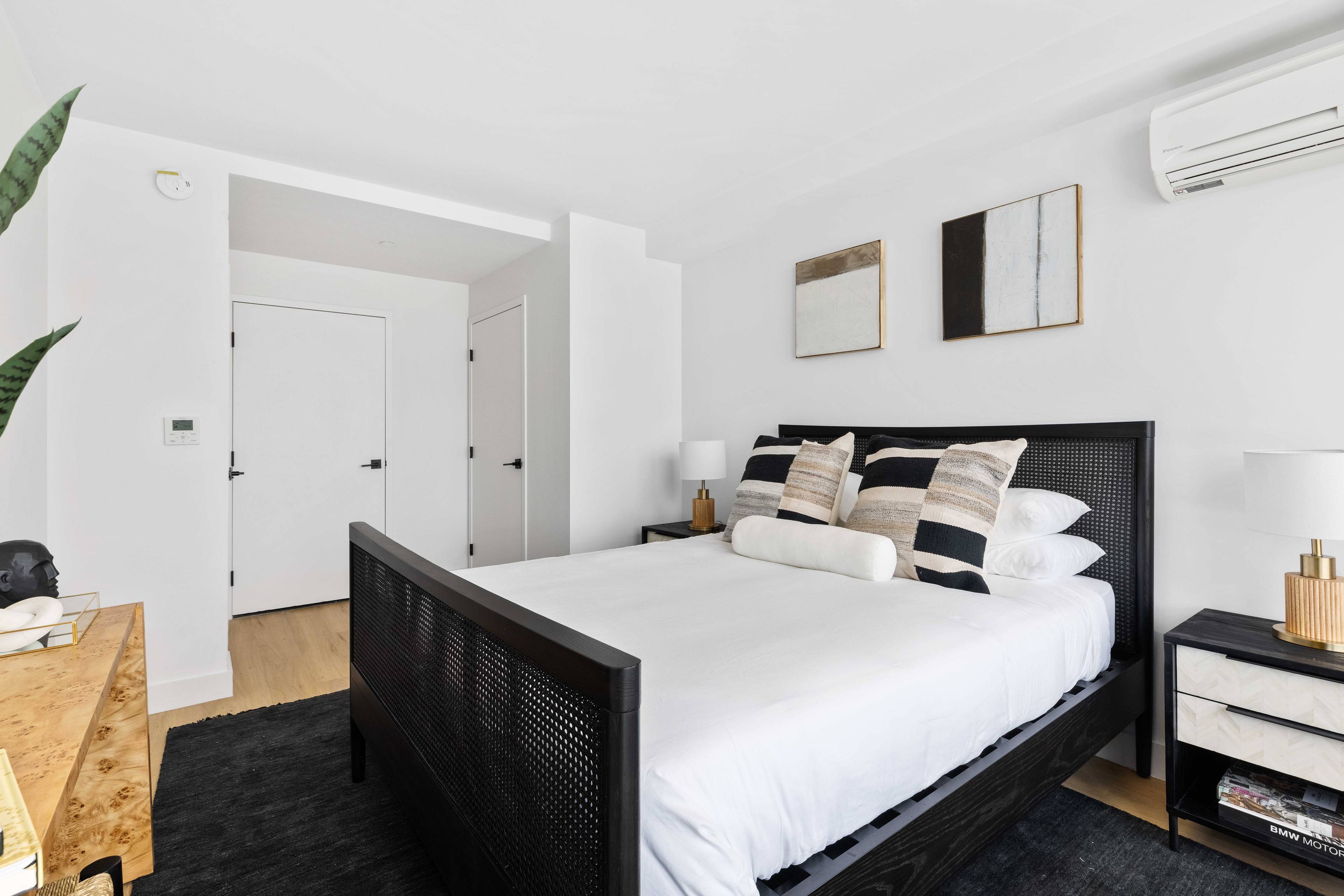 Beautiful one bedroom, one bathroom apartment with a private balcony ; featuring oversized windows, matte black and Calcutta finishes, custom tiled bathrooms, spacious closets, and in unit washer dryer.
