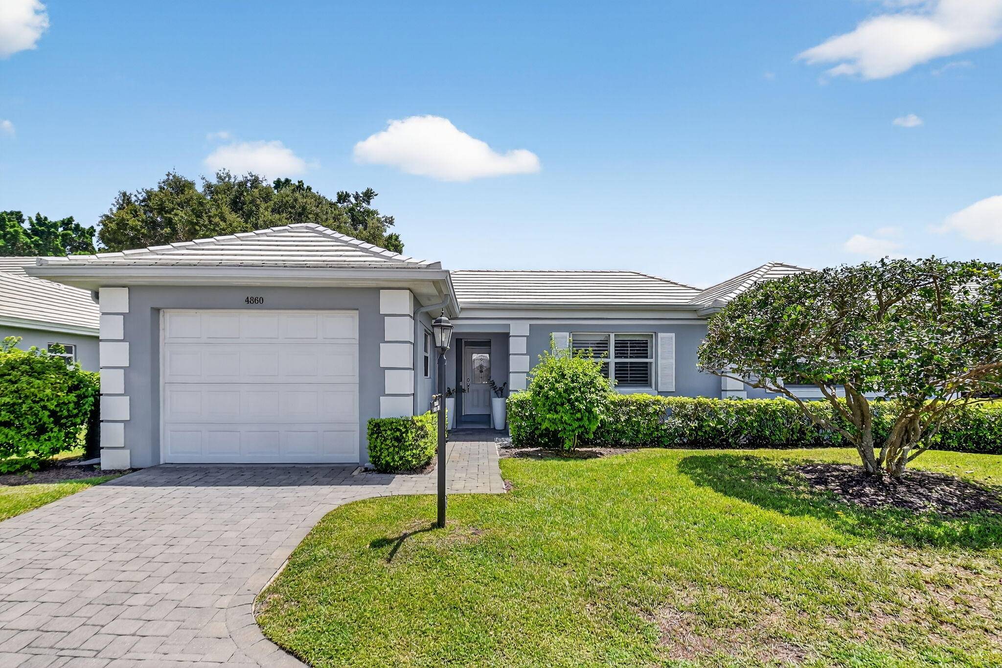 THIS COMPLETELY REMODELED VILLA HAS WIDE OPEN VIEWS OF THE 15TH FAIRWAY GREEN AT DELRAY DUNES GOLF COUNTRY CLUB.