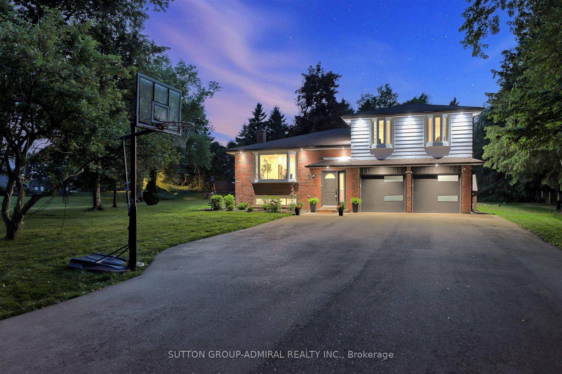 Welcome to this beautifully updated 5 Level side split nestled on a stunning, nearly one acre treed lot, offering breathtaking autumn views and serene country living.