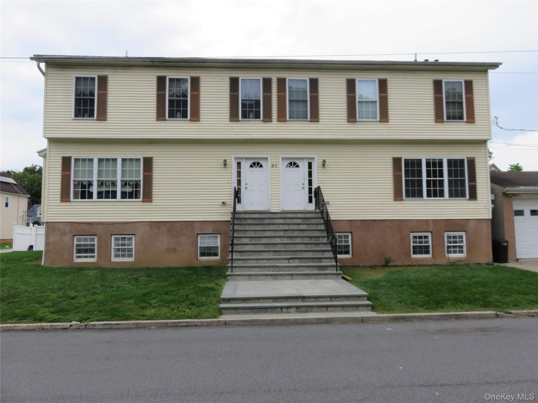 This spacious and welcoming three bedroom unit with two full and one half baths is conveniently located just one block from the Sawmill River PKWY and South County trail way.