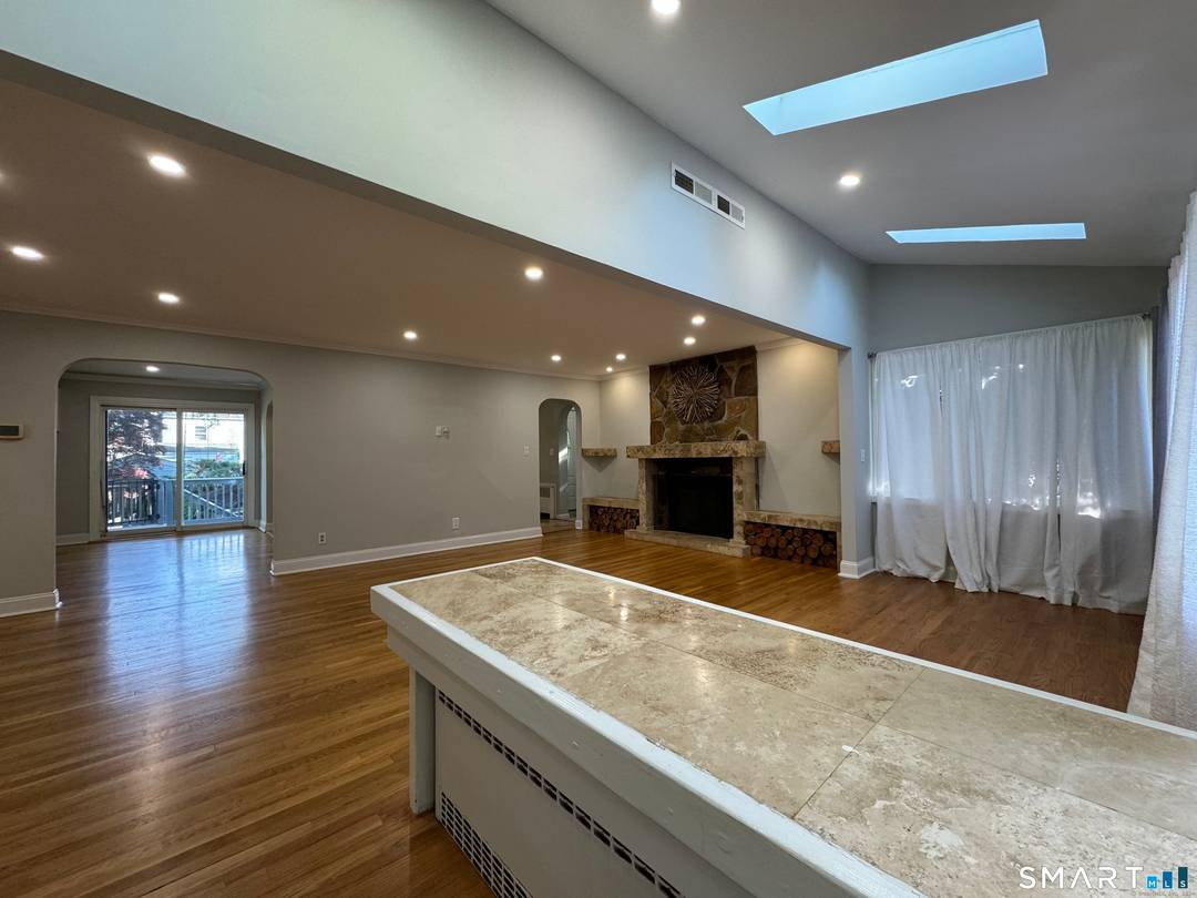 Discover comfort, space, and flexibility in this well maintained 3 bedroom, 3 bath residence located in Bridgeport's desirable North End.