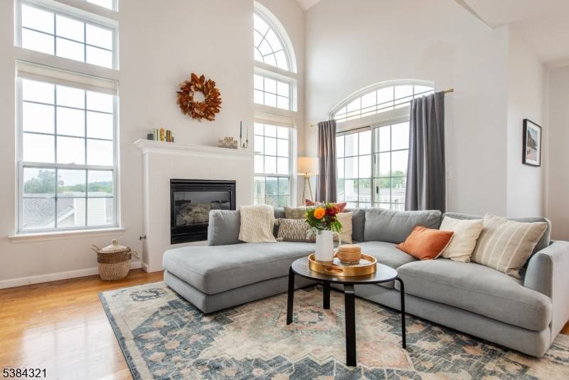 Step into this sun drenched end unit townhome in Morristown's Rose Arbor community !