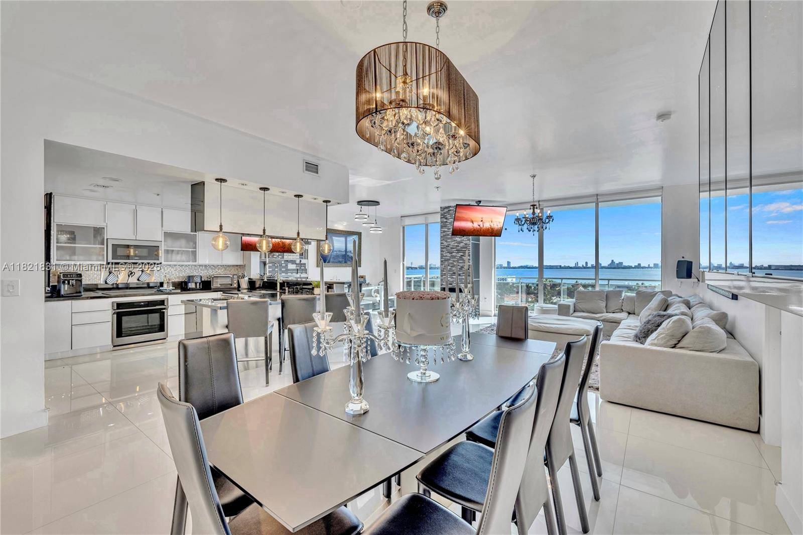 Stunning corner unit with a panoramic wraparound balcony, located in the 02 line, the best line in the building, offering unobstructed skyline and water views, including views of Biscayne Bay, ...