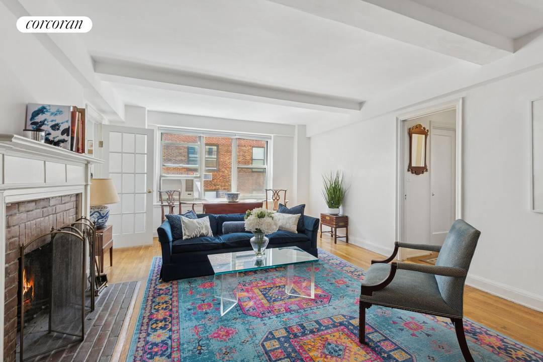Light filled, oversized, and beautifully renovated, this exceptional prewar residence features a rare wood burning fireplace and garden views in the coveted Southgate complex.
