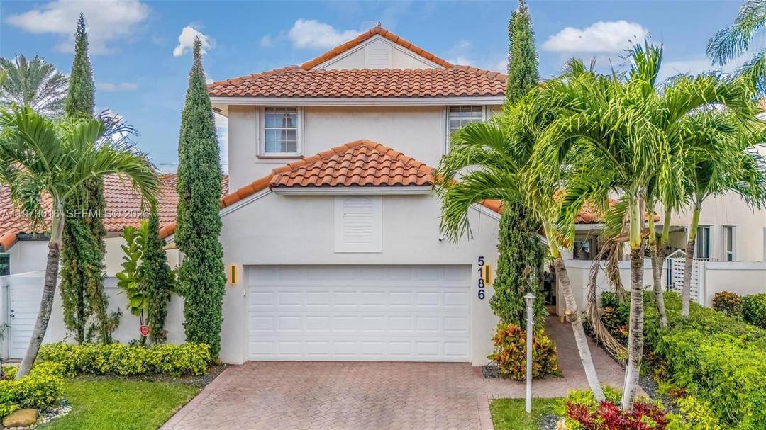 Nestled along a serene open canal in the gated community of Doral Glen at Doral Park, this fully renovated two story home blends modern elegance with resort style living.