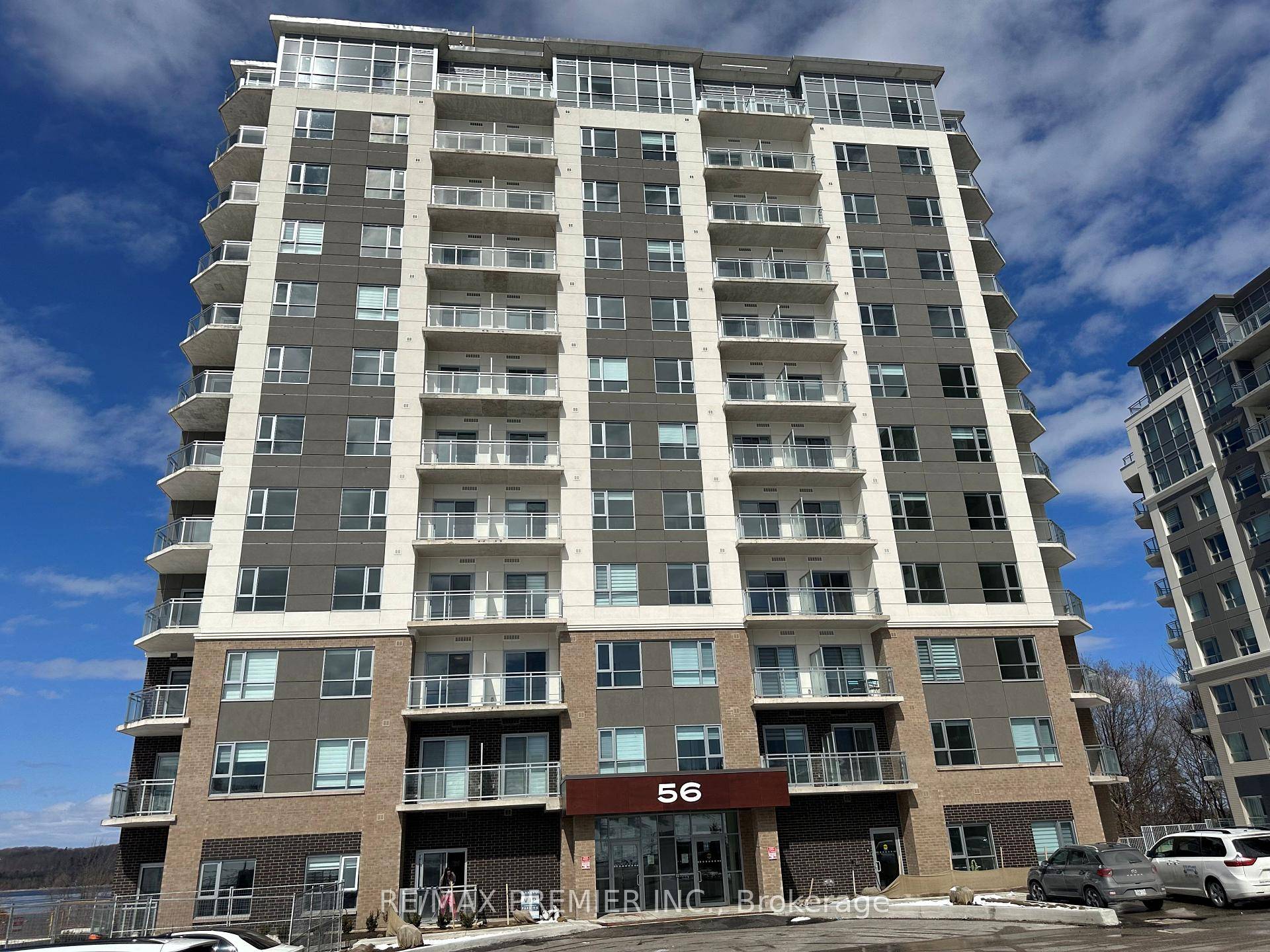 Beautiful 900 square foot apartment with a balcony, living room, and bedroom that all have a view of the lake.