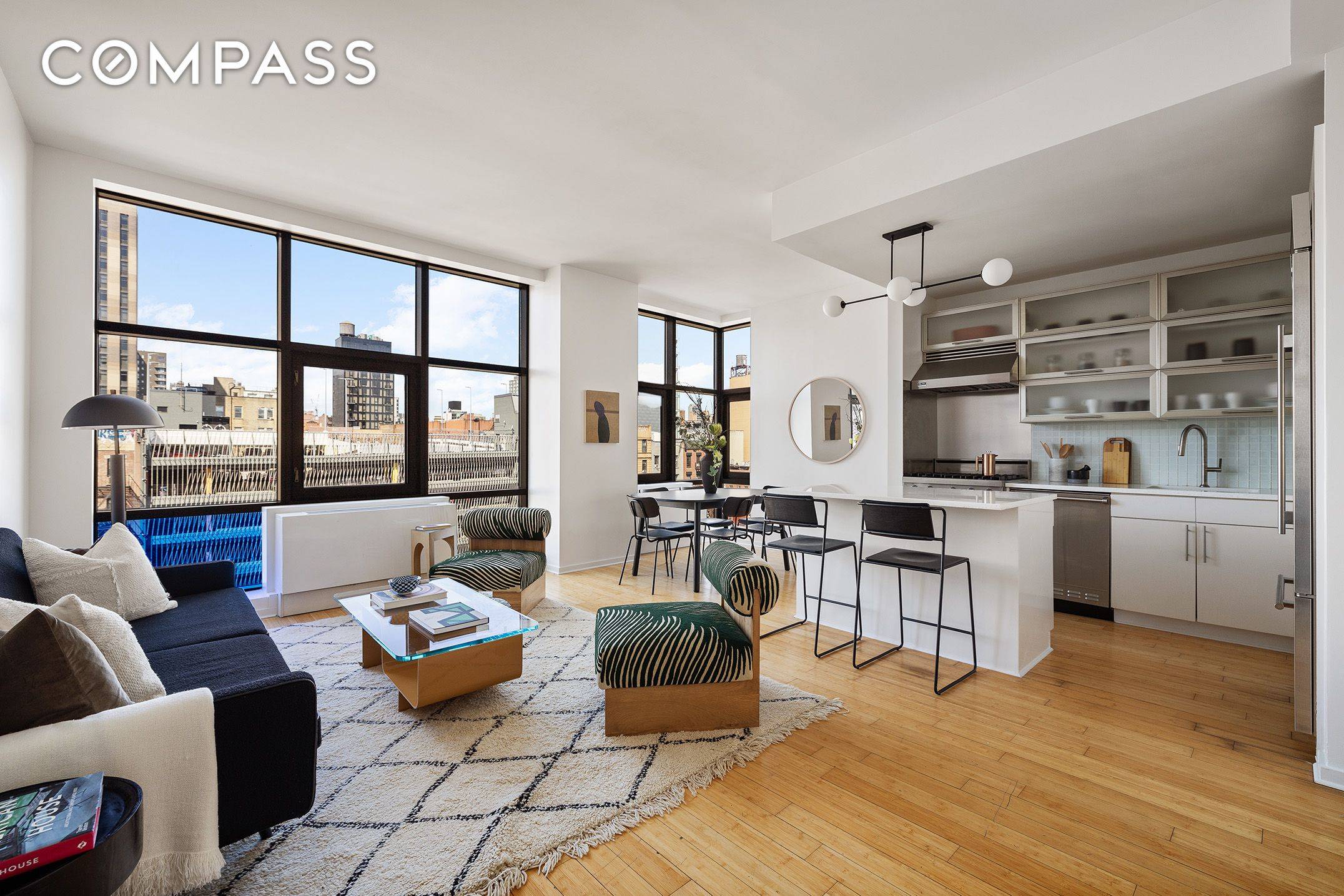 Residence 6A is a dramatic loft style condominium with nearly 10 foot ceilings, floor to ceiling windows, open skyline views of the Freedom Tower and historic downtown landmarks.