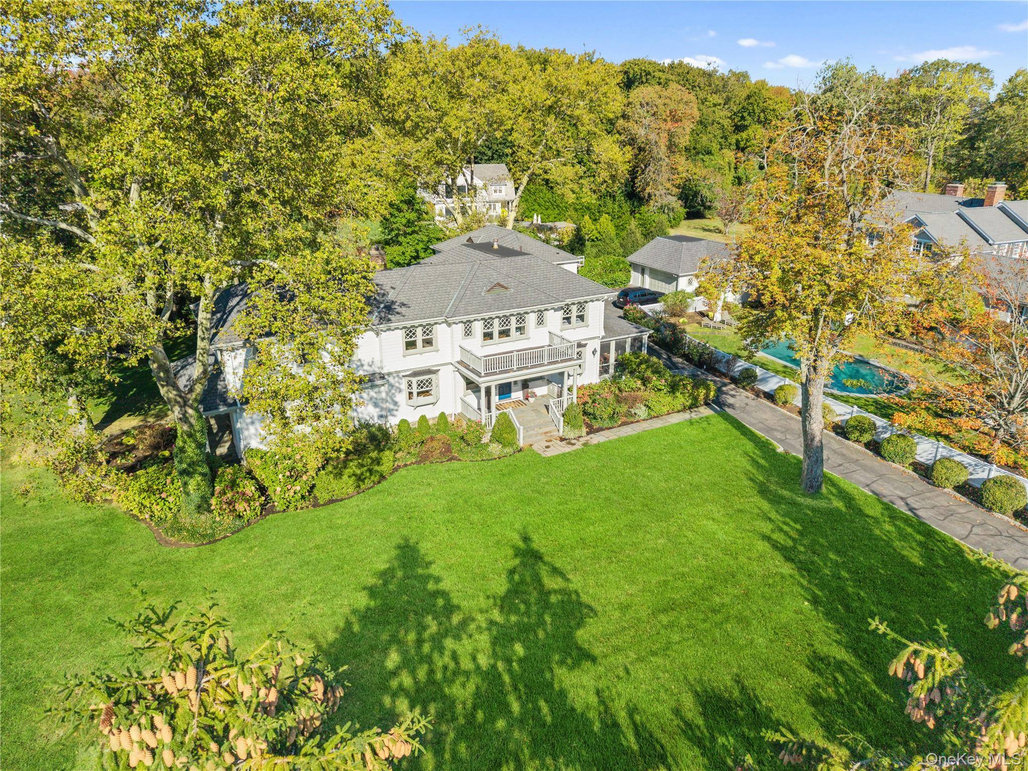 Welcome to 915 Skibo Lane, a distinguished Orienta Point estate offering a rare combination of timeless elegance and enduring style.