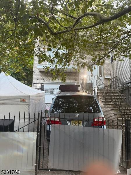 Newer 2 family home built in 2005, features a total of 8 bedrooms and 5 bathrooms, each with separate utilities for added convenience.