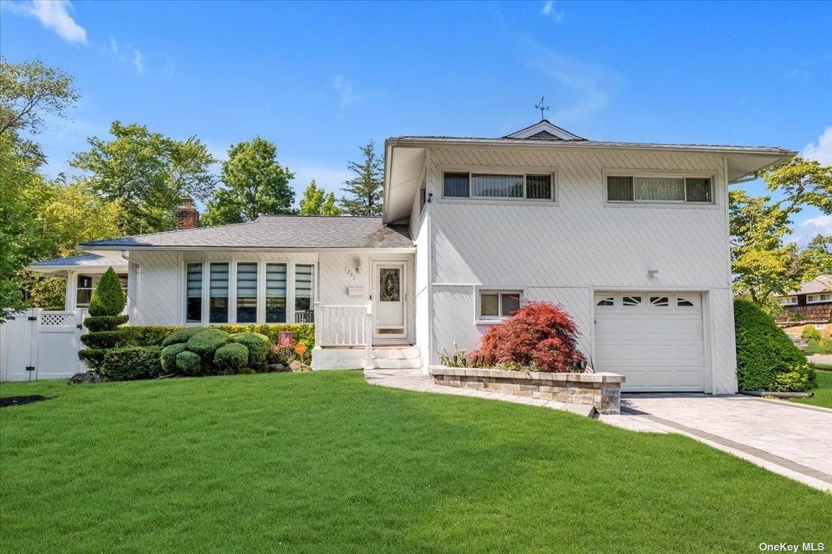 Beautifully updated throughout 4 Level Split in Barnum Woods school district offering a beautifully paved driveway and walkway, Entrance foyer leading to Living room with custom crown mouldings and window ...