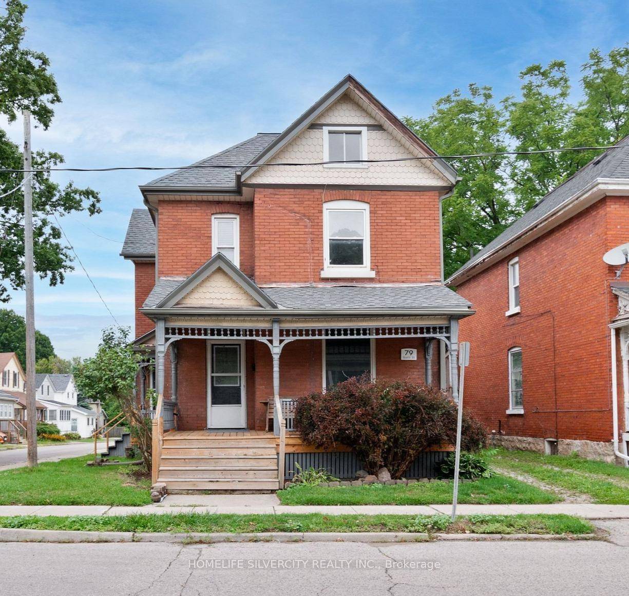Beautifully preserved red brick corner lot home, ideally located just minutes from downtown St.