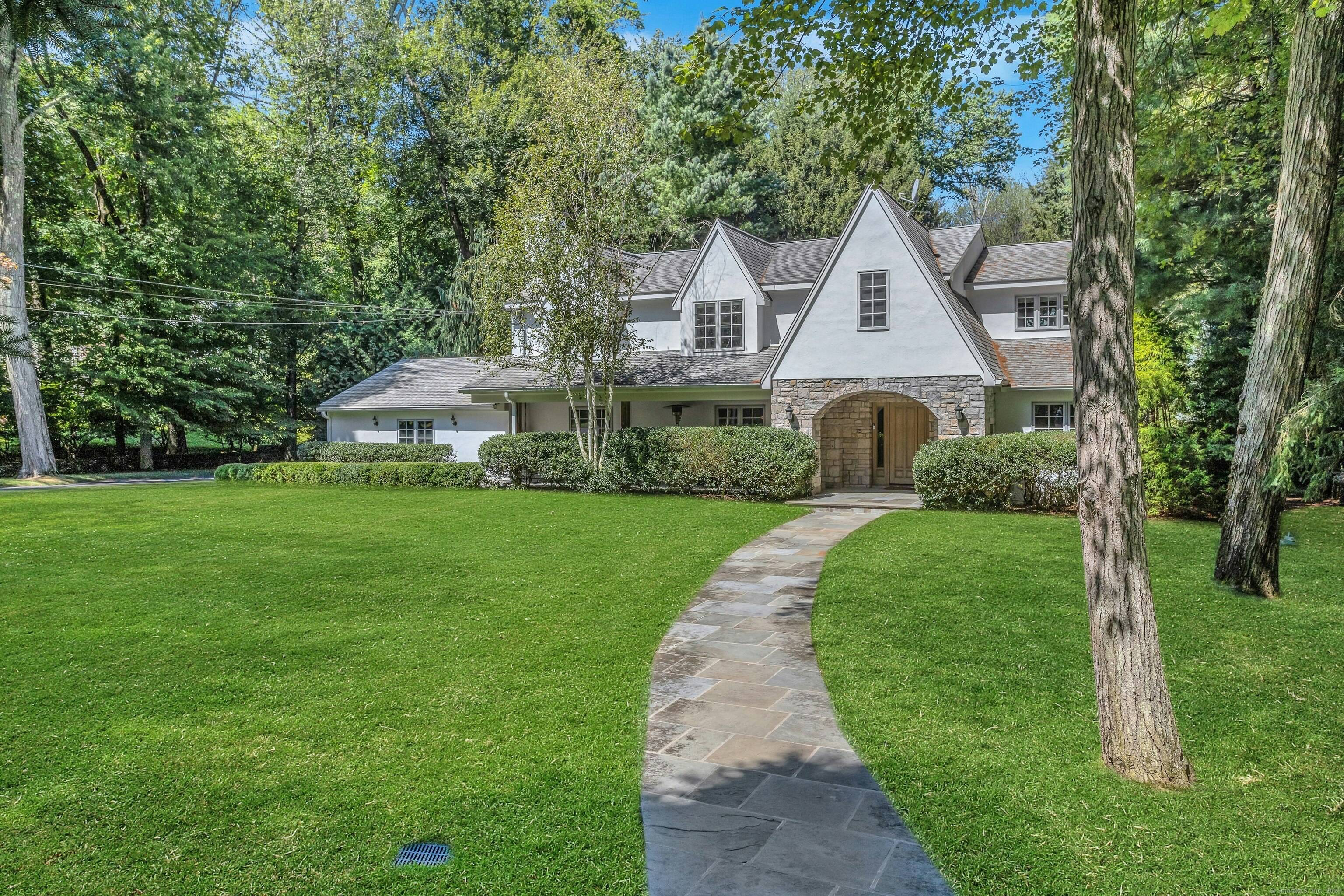 Beautifully presented in Westover, this immaculate, sun filled four bedroom, five bath residence offers an open, airy layout defined by window lined rooms and exceptional craftsmanship.