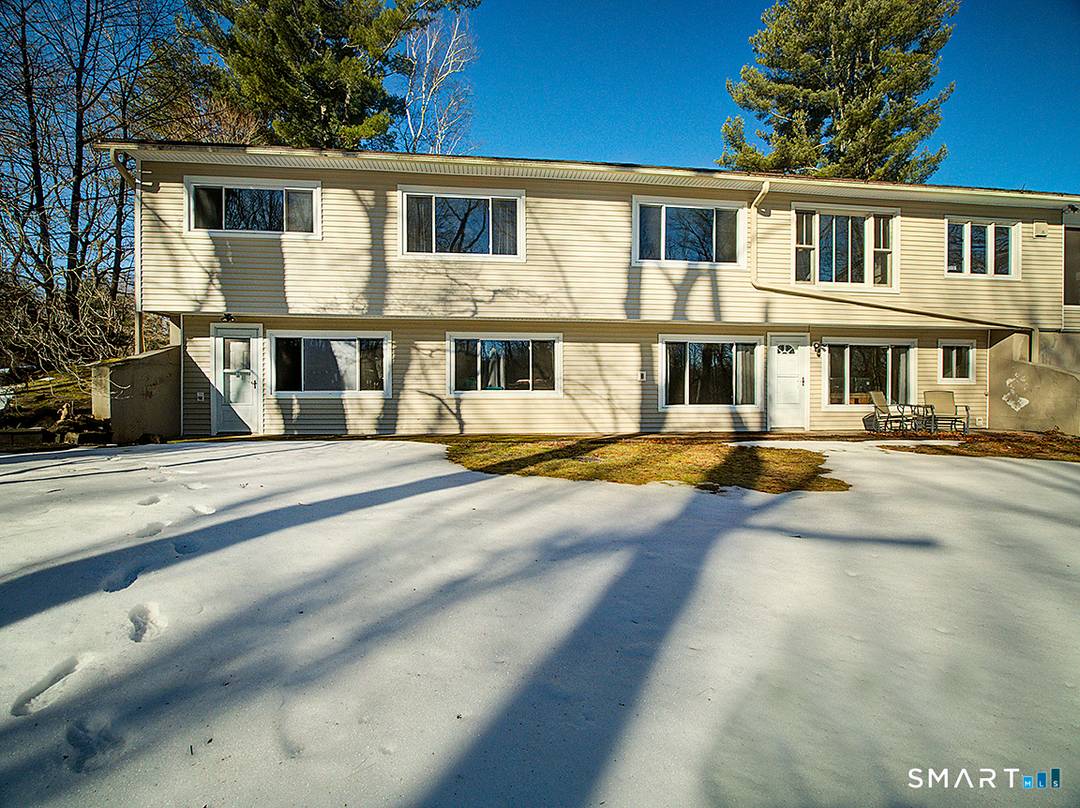 Experience refined, nature infused living in this exceptional residence overlooking the tranquil Mill River.