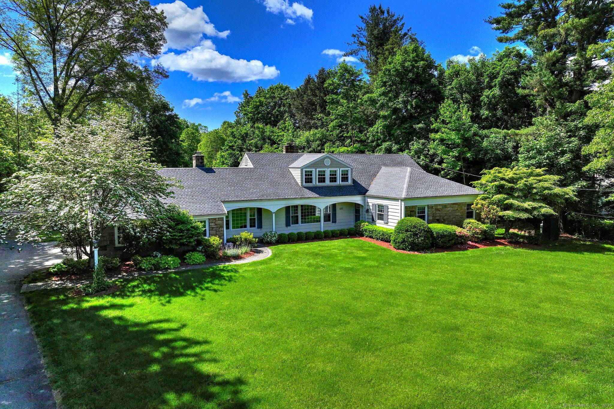 Welcome to this beautifully remodeled expanded Cape Cod style home situated on a spacious 0.