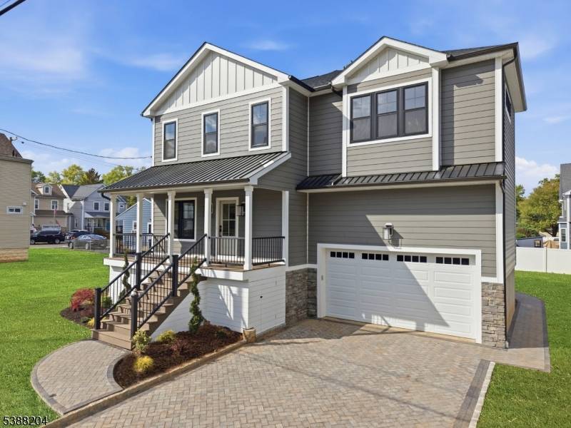 Nestled on a dead end street in the heart of Clark, this stunning custom home offers exceptional craftsmanship, designer finishes, and luxury living across three beautifully finished levels.