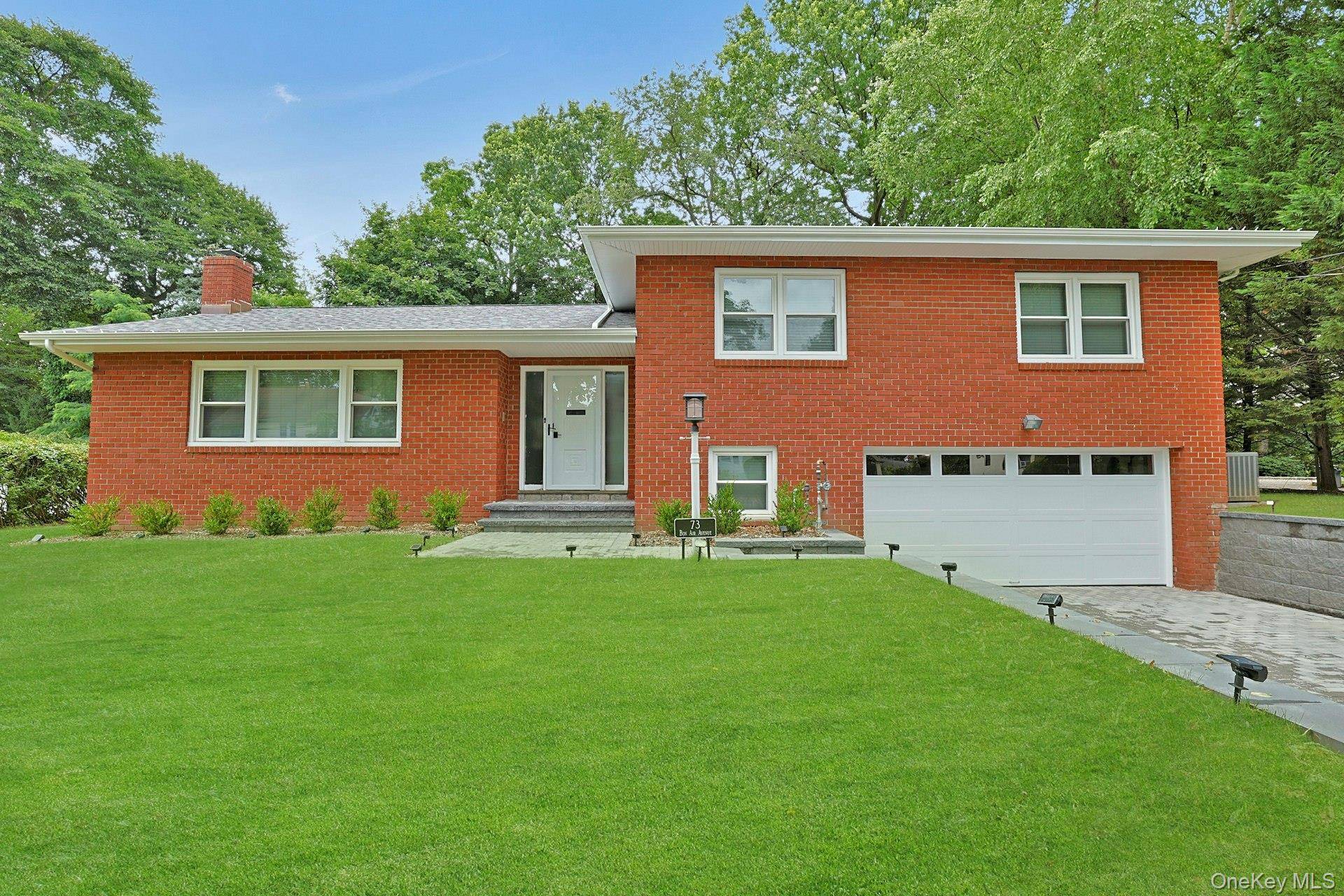 This pristine all brick split level with fantastic curb appeal offers an open plan layout with sunny rooms.