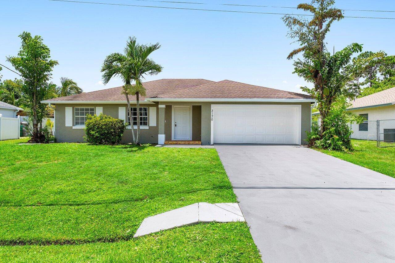 NEW ROOF ! Renovated 3 bedroom, 2 bathroom CBS home featuring a stunning new kitchen with white cabinets, granite countertops, and stainless steel appliances.