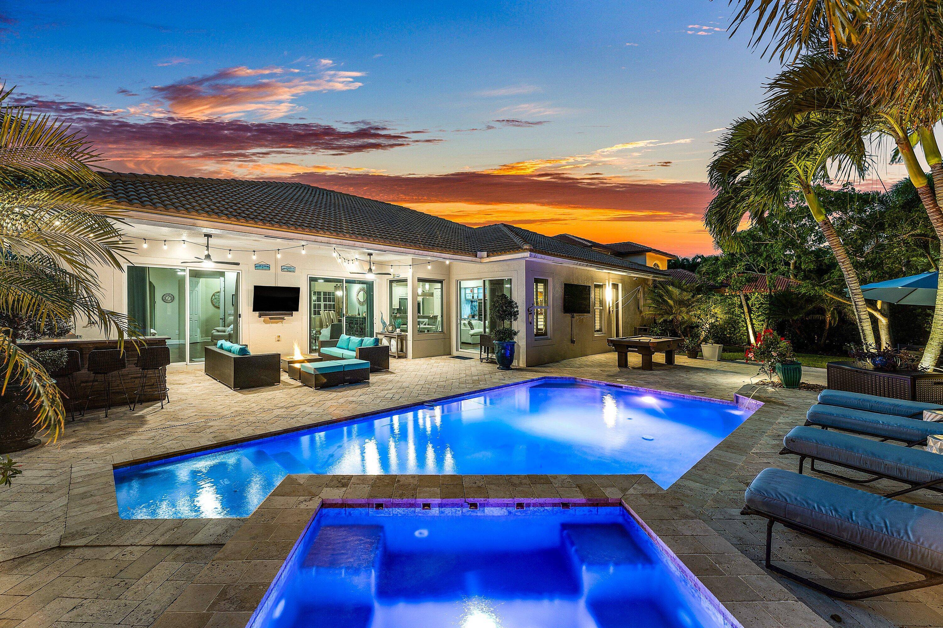 Welcome to this stunning single family residence located in the prestigious gated community of Rialto in Jupiter, Florida.