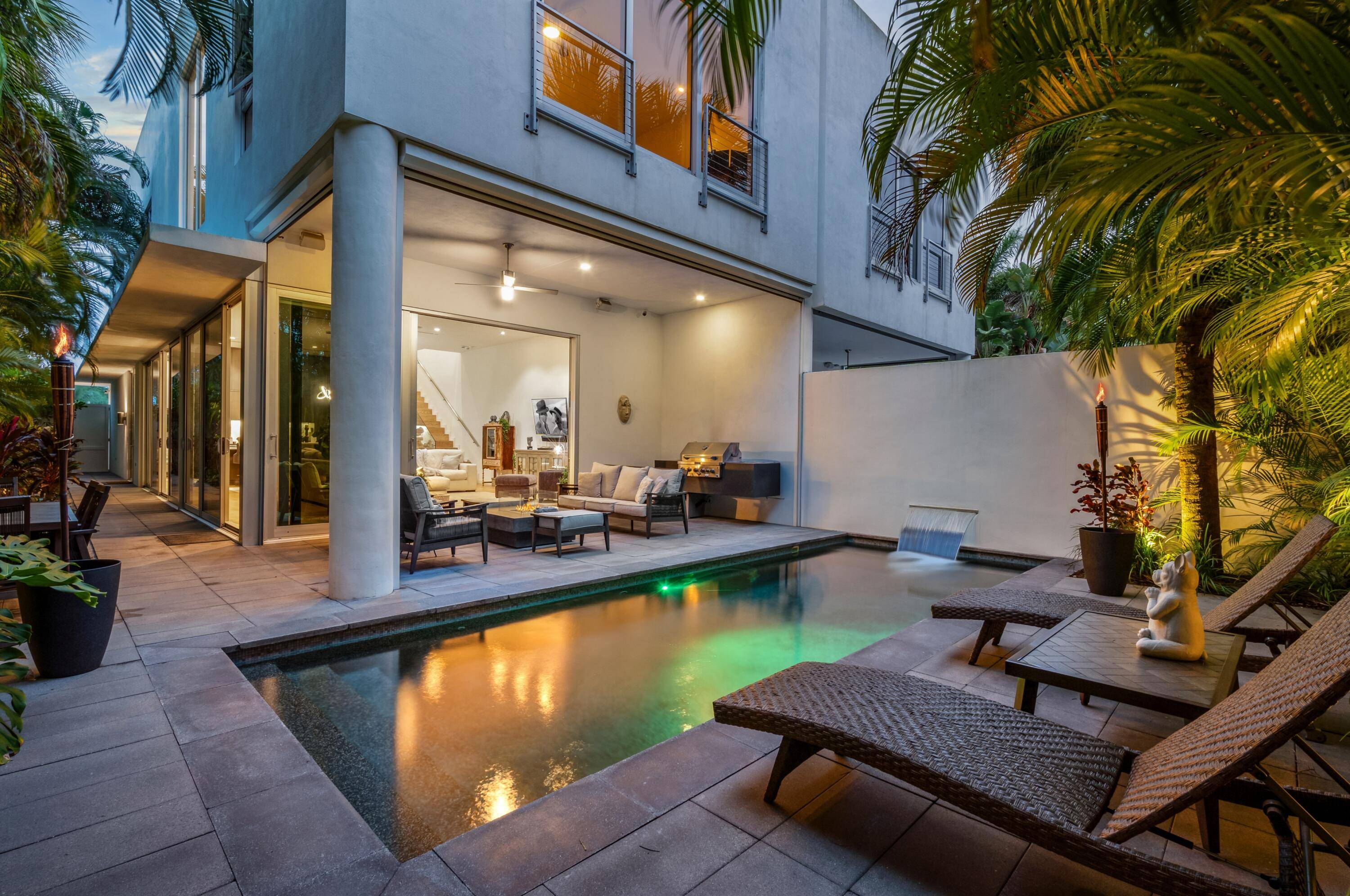 Near Atlantic Avenue and the ocean, this chic custom townhome, with no HOA, features a stunning open floorplan in a unique configuration that creatively elevates the living, dining and kitchen ...