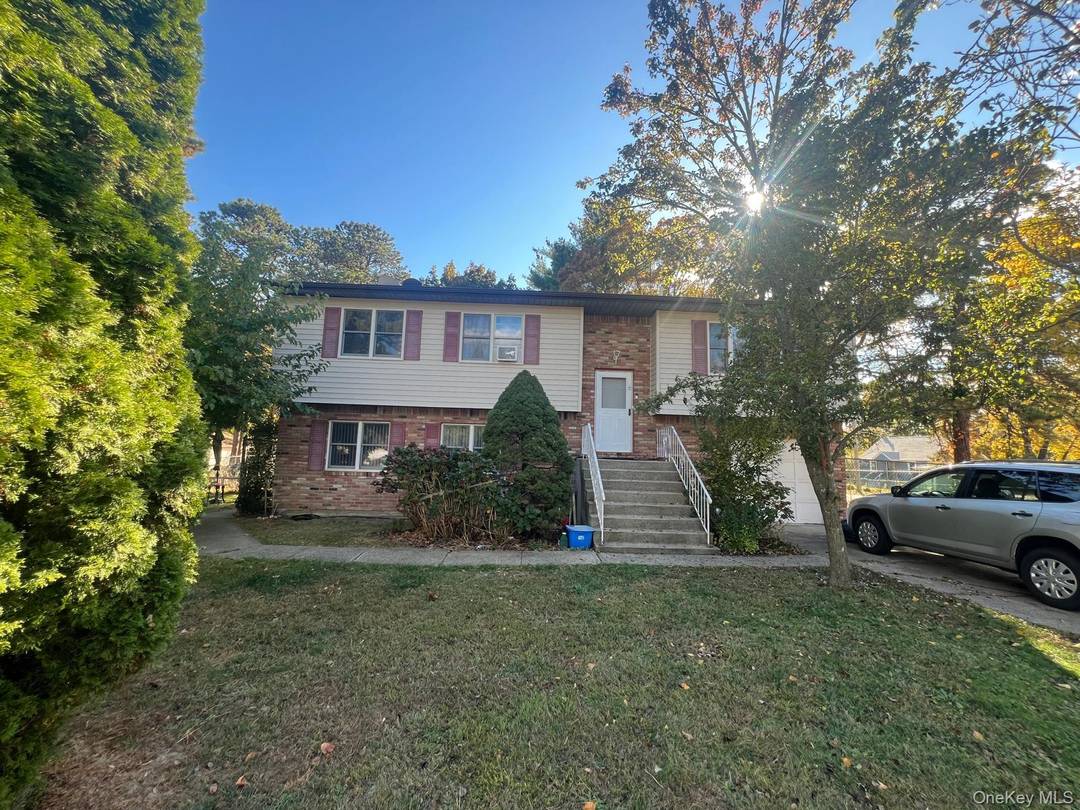 Welcome to 60 New Hampshire Ave, a spacious Hi Ranch home offering comfort, functionality, and style !