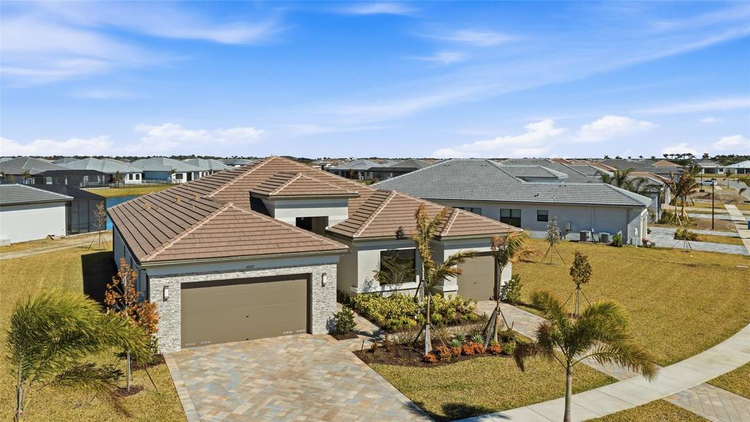 Stunning 2025 New Construction, Bellagio luxury single family residence, offering 2668 sf of refined living space on a rare oversized water front lot.