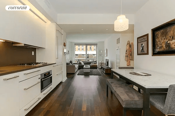 Bright and airy, this one bedroom home at The Gramercy by Starck offers a spacious layout with floor to ceiling windows and dark oak wood floors.