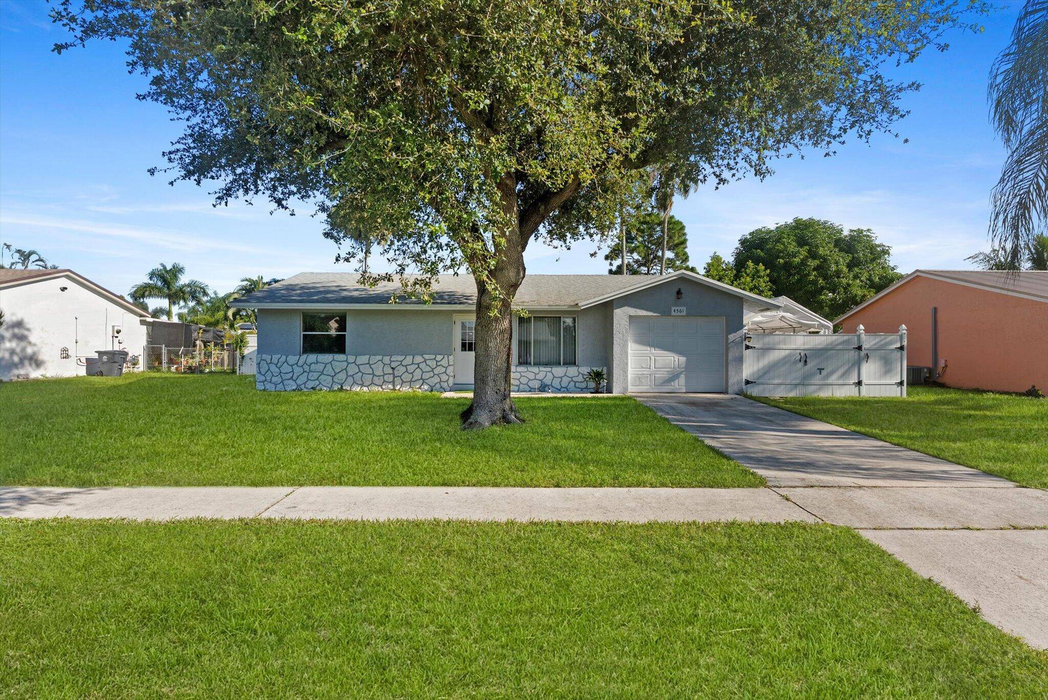 Charming 2 bedroom, 1 bath home featuring a fully renovated bathroom, new refrigerator and dishwasher, and a 1 car garage.