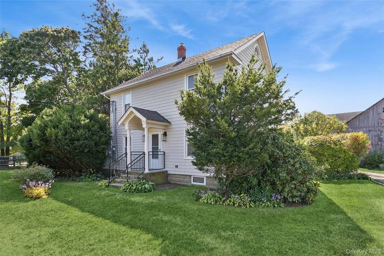 Welcome to 335 Herricks Lane, a unique and charming residence nestled in the heart of Jamesport, NY.