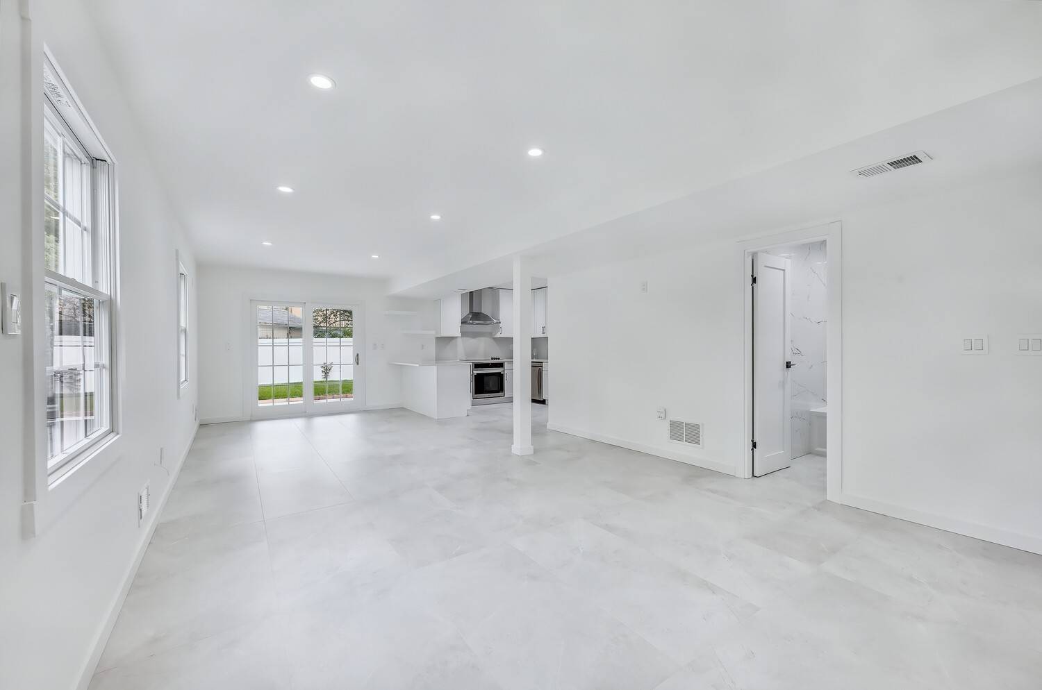 Welcome to a beautifully reimagined home in Brooklyn's exclusive, gated Seagate community.