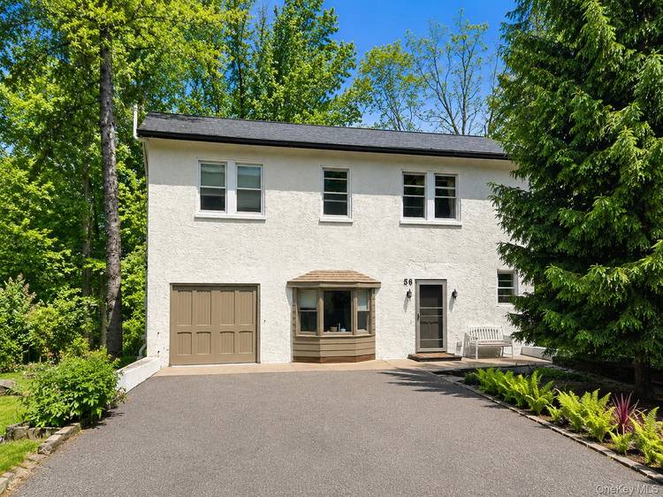 Welcome to this charming Carriage House located within the prestigious gated community of Tuxedo Park.