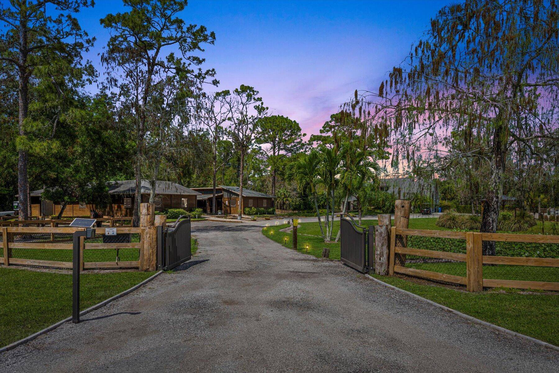Welcome to your enchanting equestrian retreat nestled within the prestigious, man gated community of Homeland.