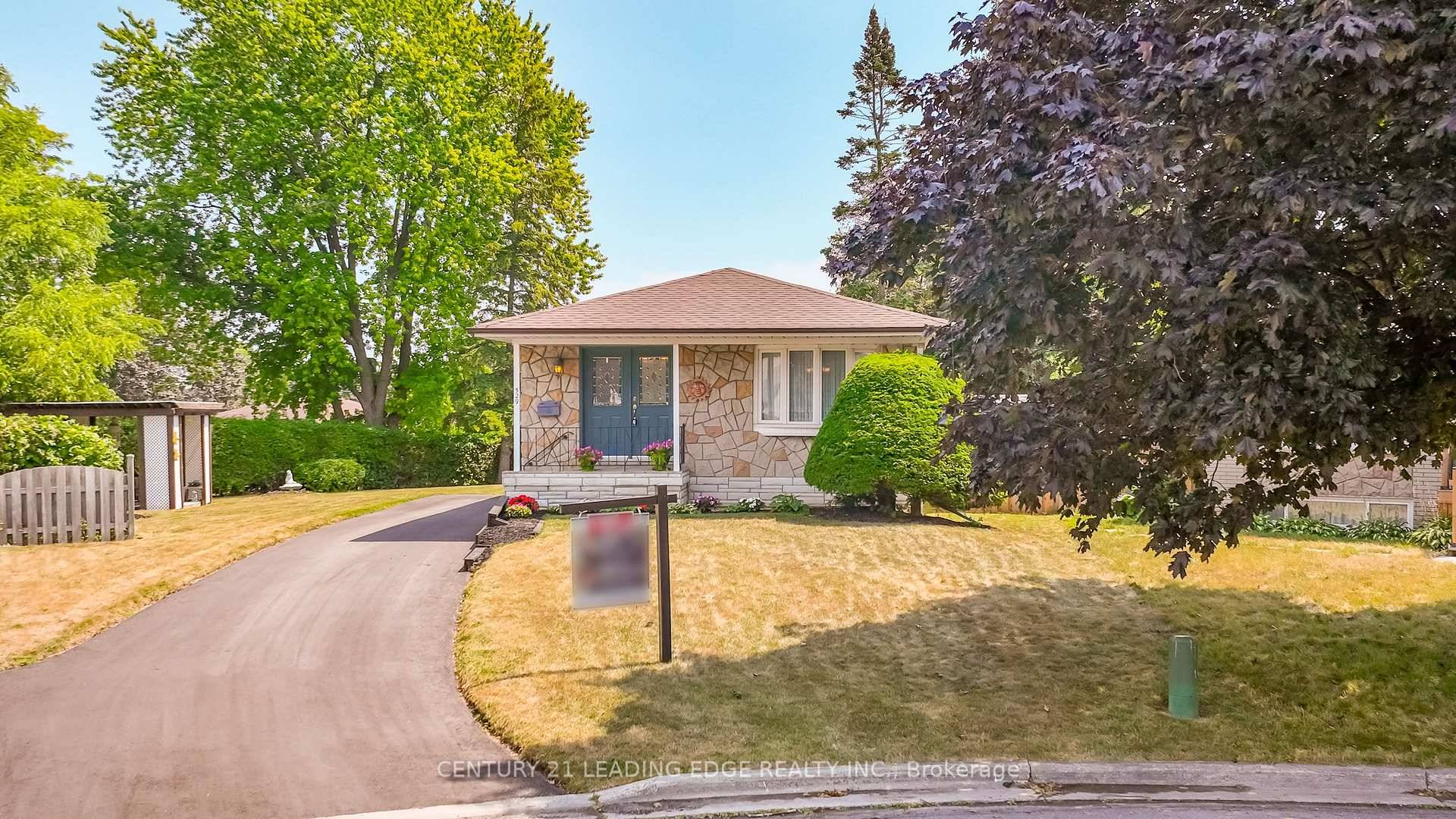 Escape to serenity in this charming bungalow on a spacious pie shaped lot.
