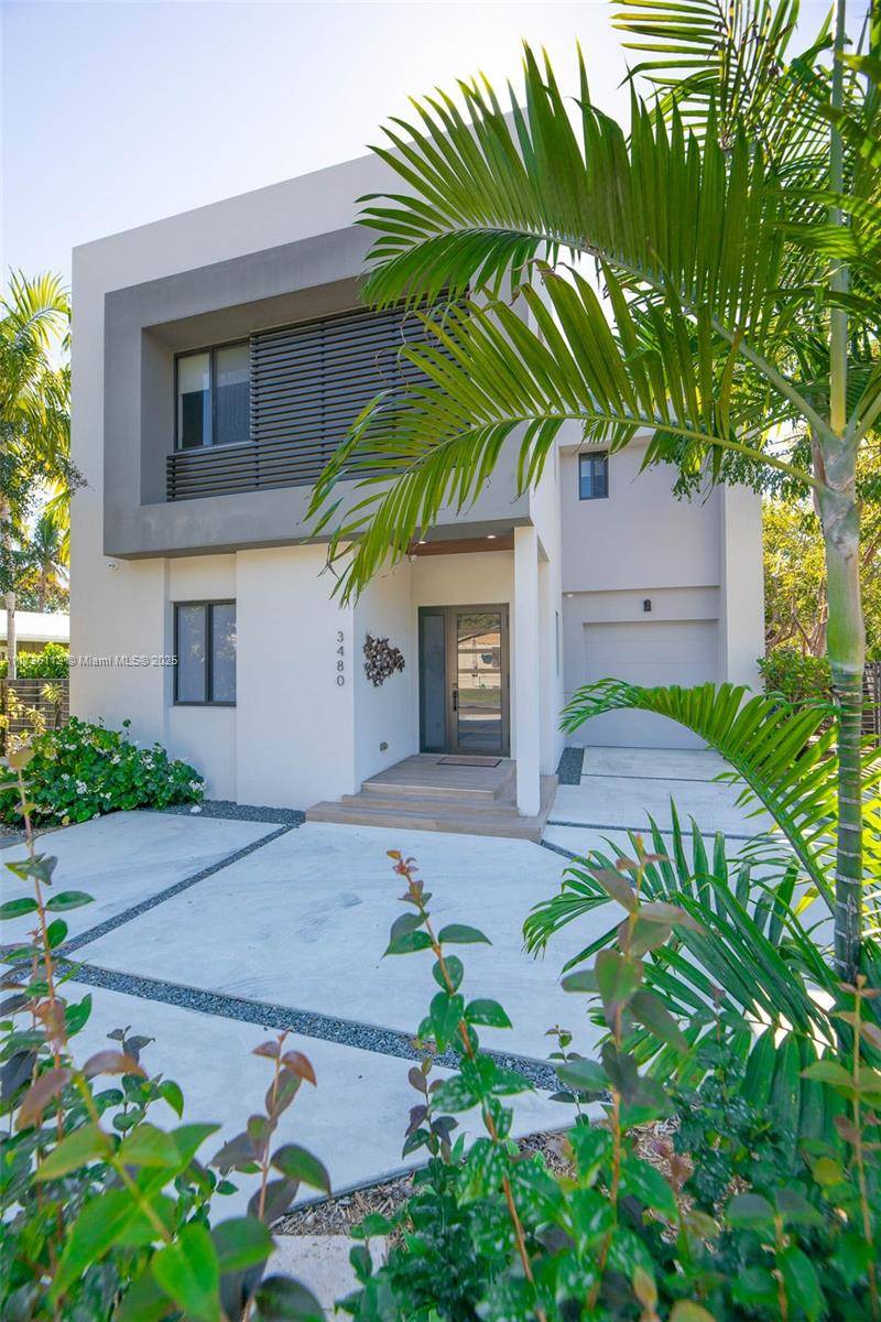 Discover this stunning two story modern home on a prime corner lot with a spacious yard.
