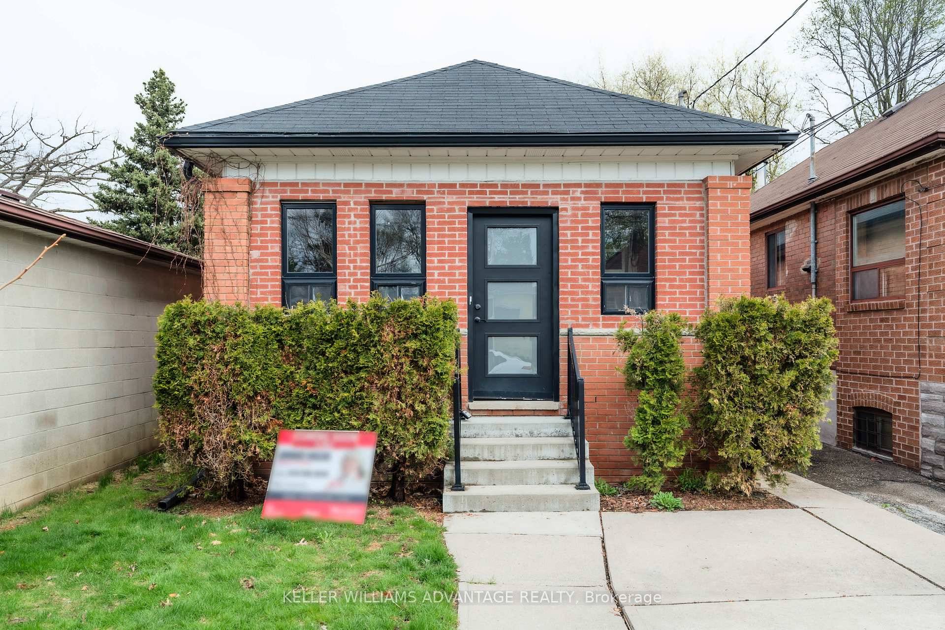 Cute as a Button Detached Bungalow with Laneway Potential !