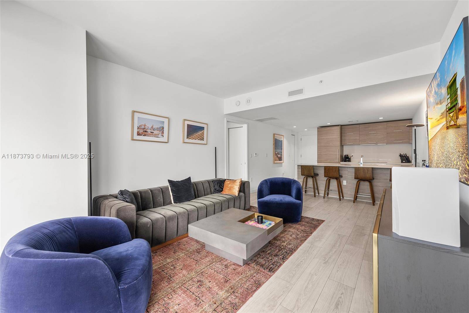 Step inside this open amp ; bright condo nestled on one of Brickell's quieter southern corners.