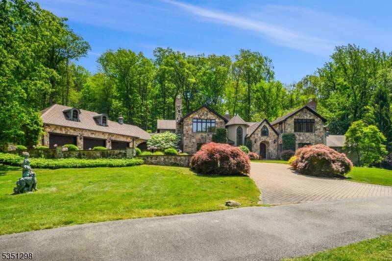 Nestled within the scenic Mendham Borough landscape, this exceptional property presents a stunning 5 bedroom European country estate, meticulously expanded and renovated in 2001 to create an unparalleled living experience.