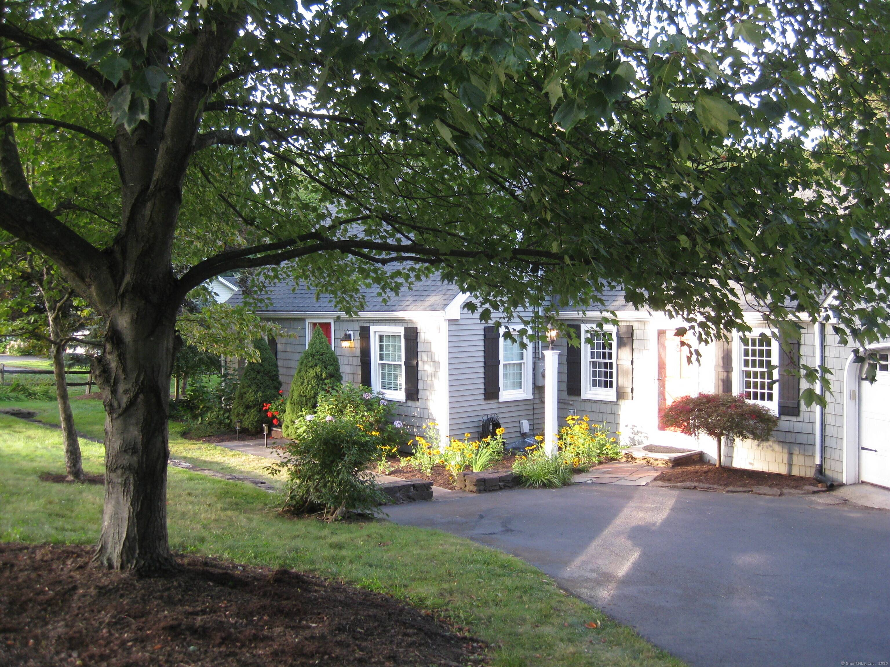 Located on one of Suffield's most desirable streets, just steps from Main Street and the Suffield Country Club, this classic New England Cape blends timeless character with modern comfort.