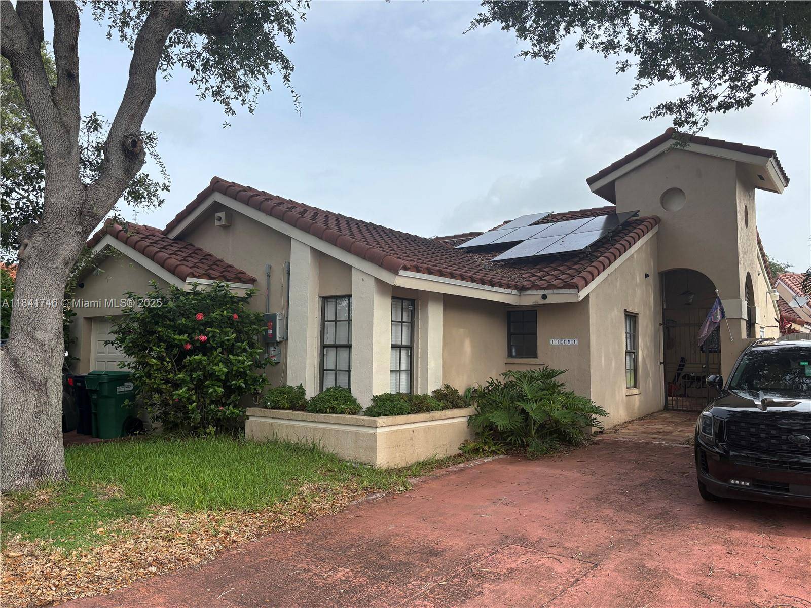 Charming 3 2 corner home in gated Chestnut Woods.