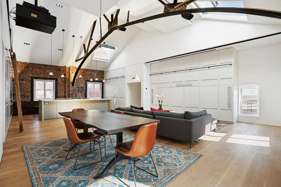 This is a truly unique opportunity to purchase and combine adjacent apartments 6N and 6M on the top floor of the grand, historic Police Building in Nolita.