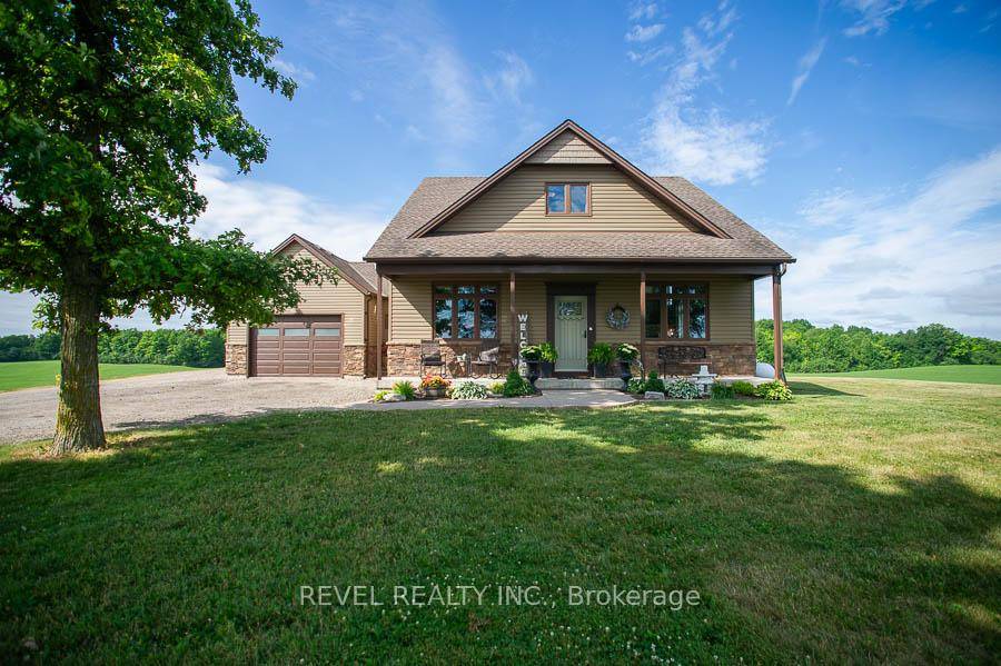 Welcome to 173 Old Onondaga Road E, a beautifully crafted custom two storey home nestled on a breathtaking 1.