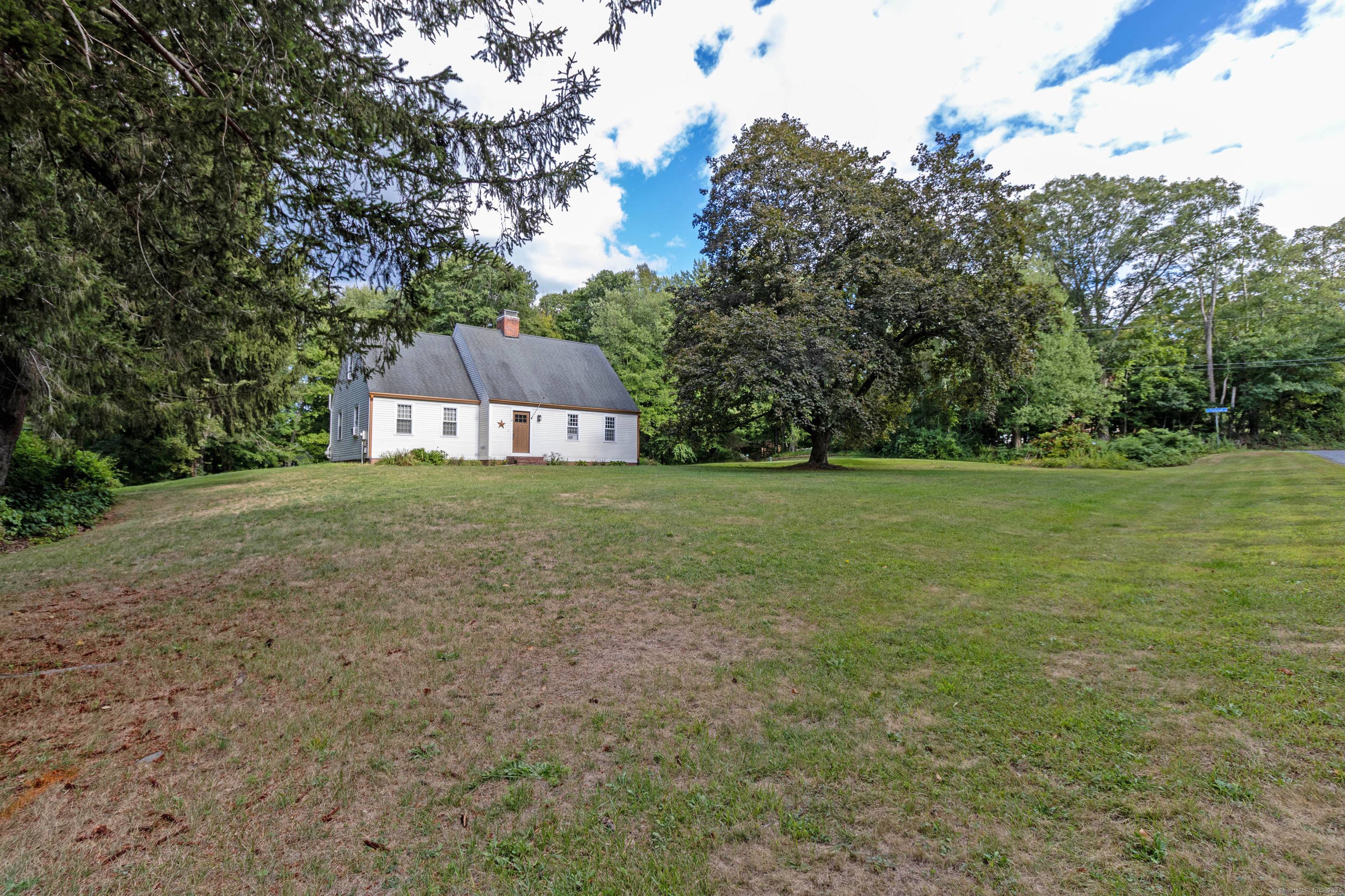 Welcome to this stunning home set on a sprawling corner lot, where traditional charm meets modern comfort.