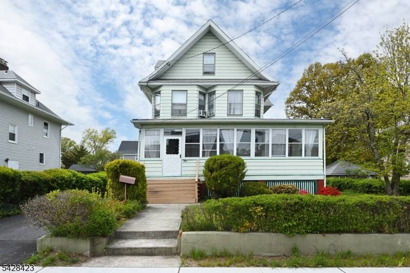 Turn of the century Colonial style home, situated on an oversized lot.