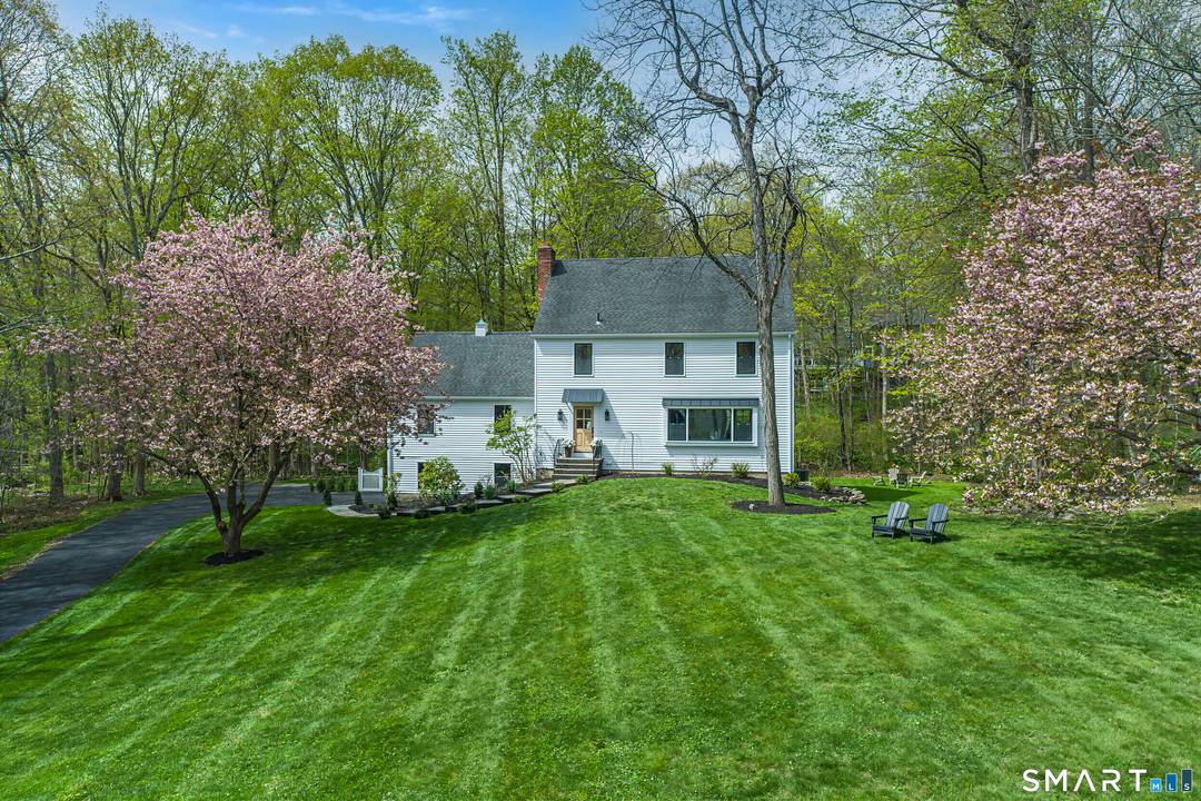 Classic Colonial reimagined w a modern French sensibility, set on a beautifully landscaped acre in South Ridgefield near the Wilton border.