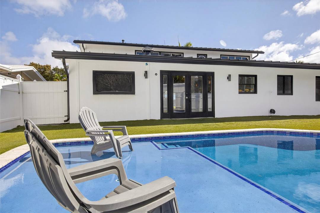 Modern luxury meets old Florida coastal charm in this 4 bedroom, 3 full bathroom waterfront home.