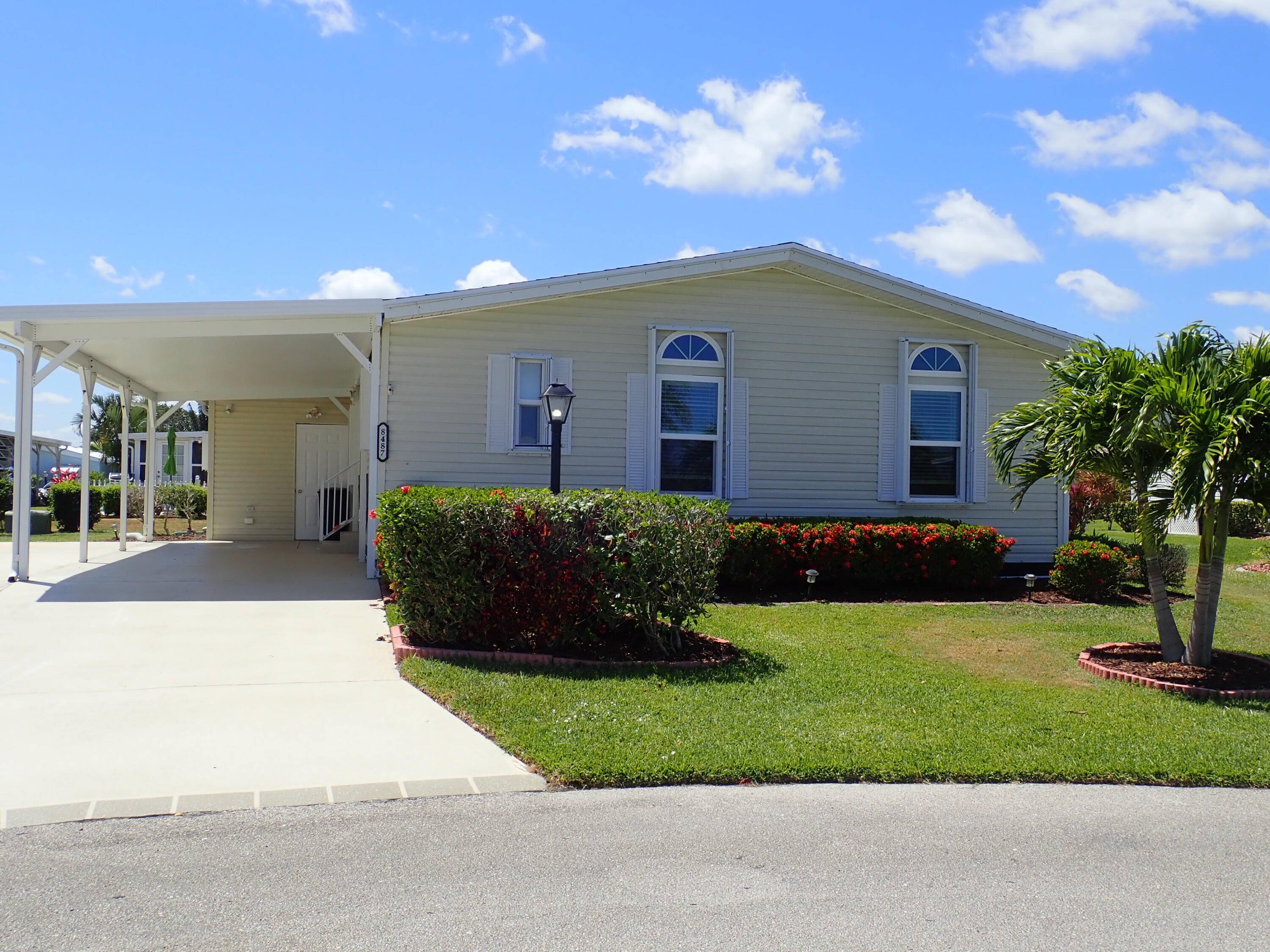 Clean and bright two bedroom, two bath home with a screened in lanai with beautiful side slide windows with an air conditioner for maximum comfort.