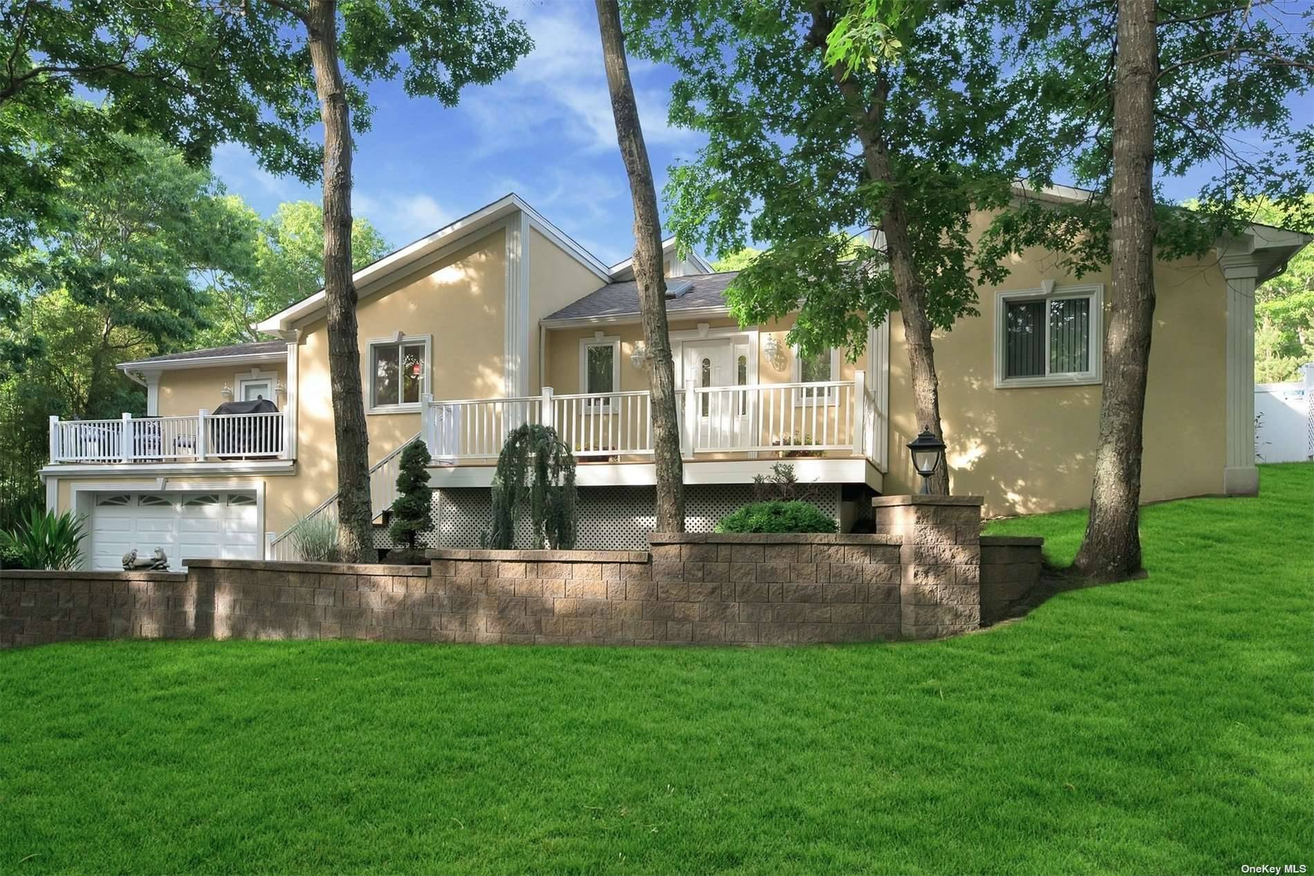 Lovely getaway for the summer with 4 bedrooms, 3 baths, wood floors, CAC, large kitchen, beautiful pool with waterfall, lush plantings surround outdoors.