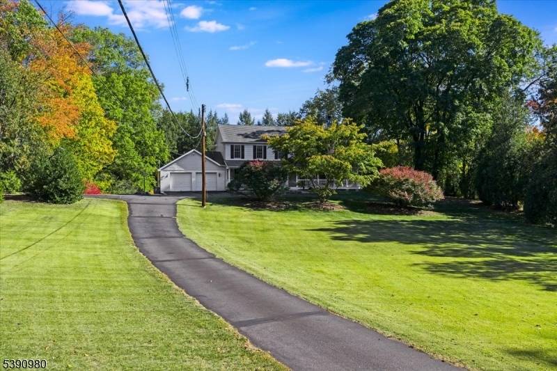 Welcome to this stunning Colonial style home with wrap around lemonade porch set on a private 1.