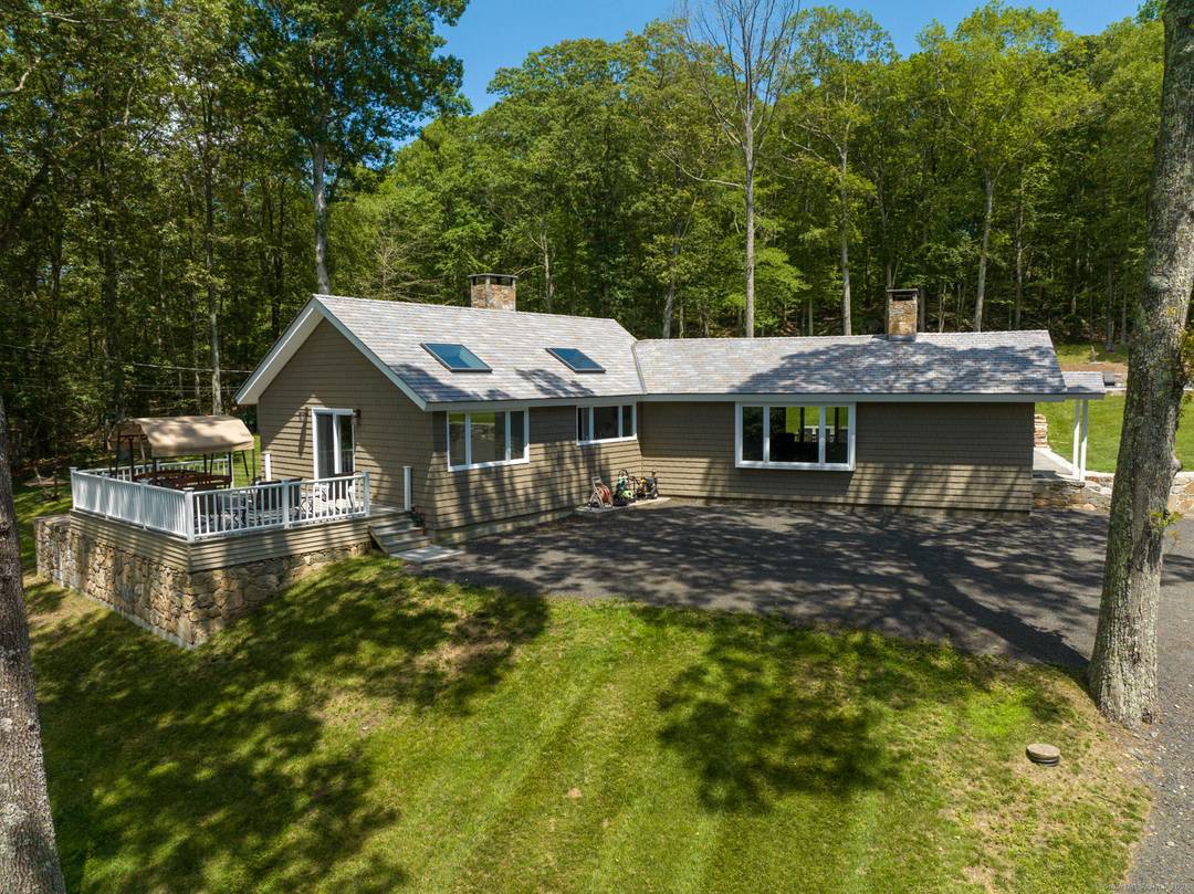 At the end of a long, winding private driveway, this exceptional Roxbury estate offers total seclusion tranquility surrounded entirely by protected land trust.